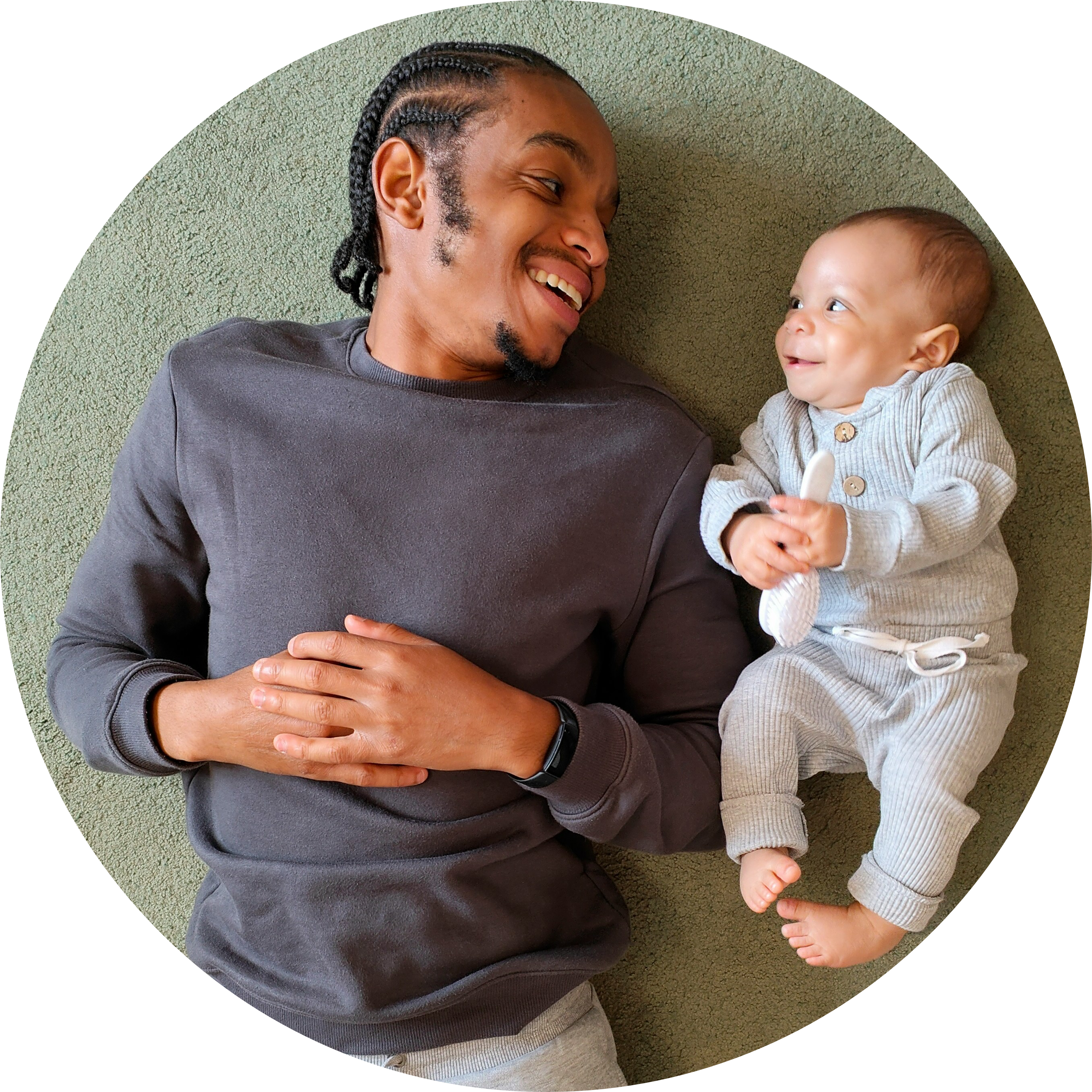 Father and newborn son looking at each other