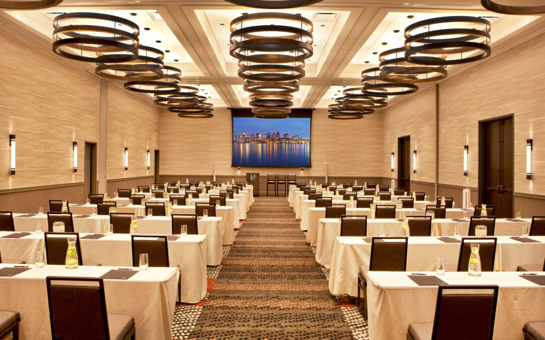 Windowless hotel meeting room setup for a business conference