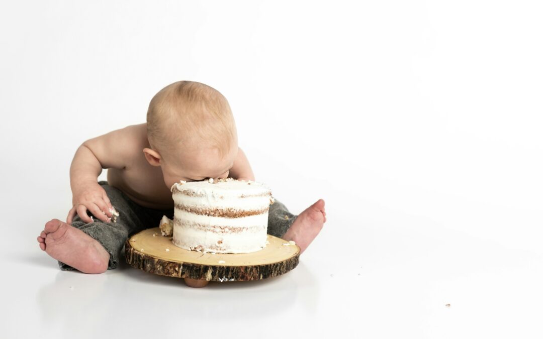 Baby with his face in a cake