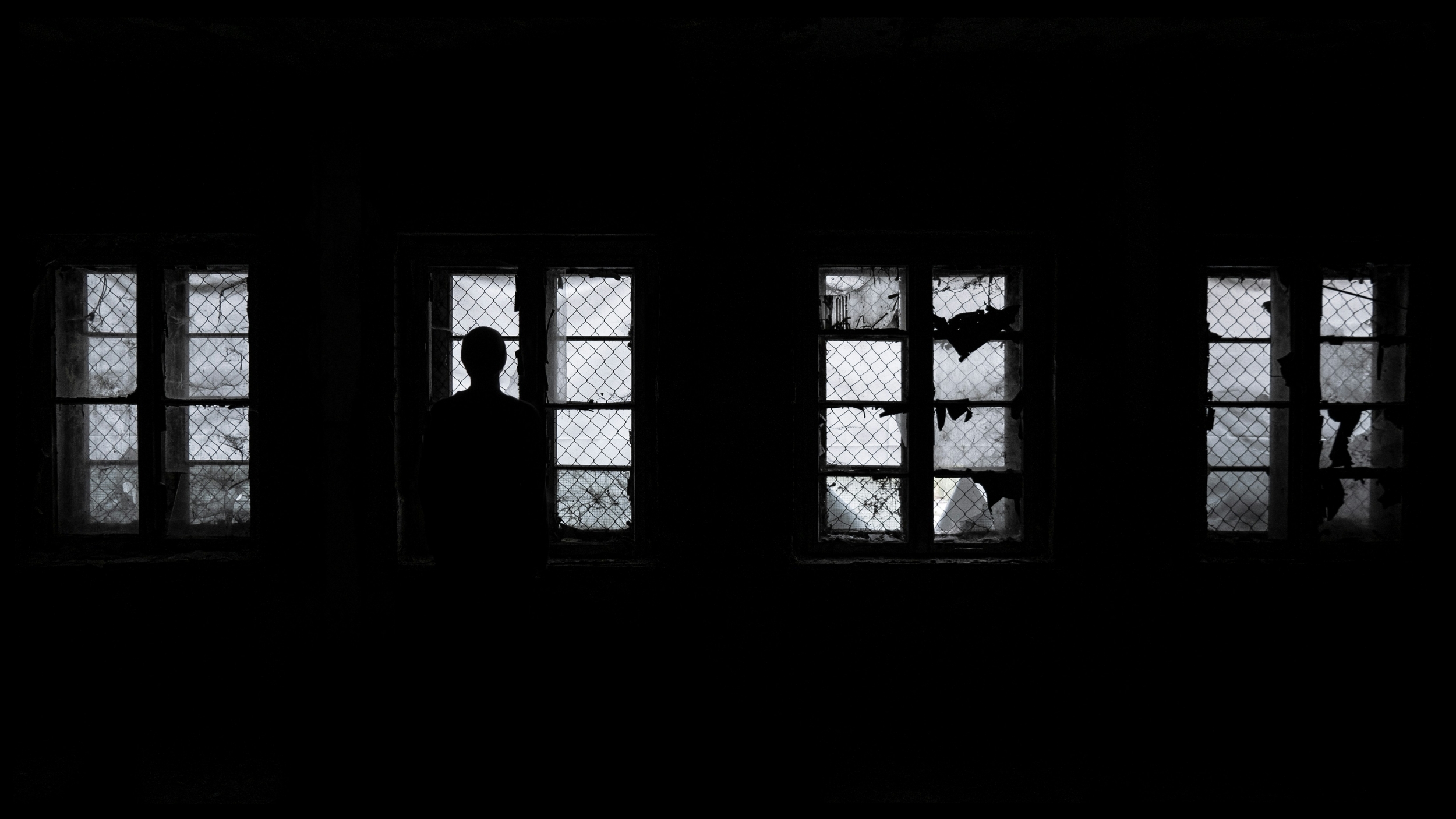 Silhouette of a figure in a window